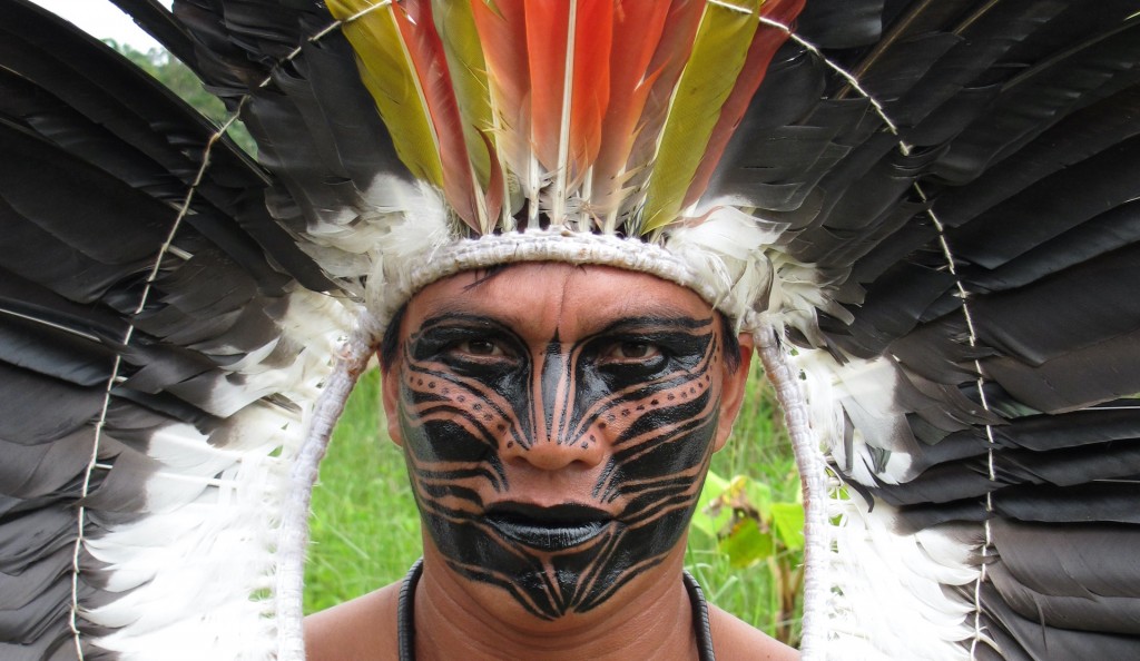 Yawanawá warrior wearing headdress of King Vulture feathers