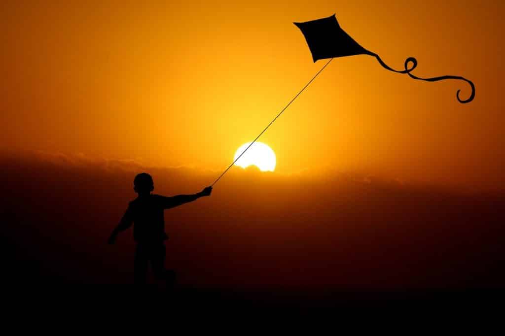 child flying kite using cbd for children